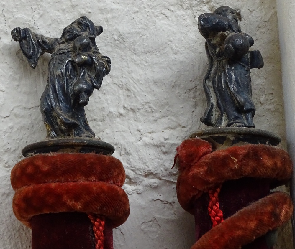 A pair of velvet-covered ceremonial staffs surmounted by white metal religious figures - Image 2 of 2