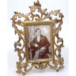 A Victorian gilded-metal acanthus decorated photo frame, height 11"