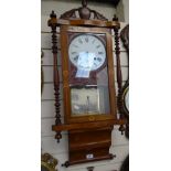 An ornate marquetry inlaid 2-train wall clock, height 35"