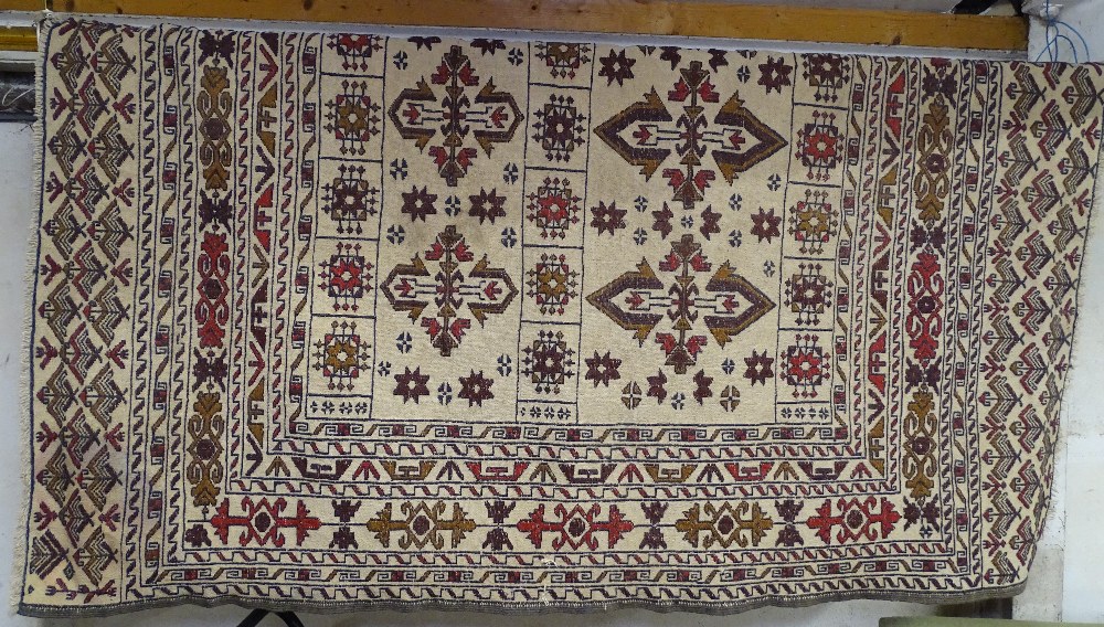 A cream ground Kilim rug, 183cm x 137cm