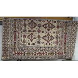 A cream ground Kilim rug, 183cm x 137cm