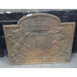 An Antique cast-iron fireback with embossed decoration, W59cm, H50cm