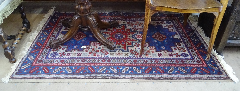 A blue ground Persian design rug, 155cm x 100cm