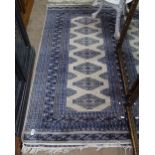 A blue ground Afghan design rug, 163cm x 93cm