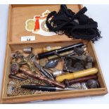 A box of various items, including a knife, a fountain pen, a carriage key etc