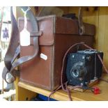 A mid-20th century Explosive Dynamo condenser in leather case, and an American Morse camera (2)