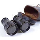 A pair of le Maire brass and leather binoculars, circa 1900, with rotating theatre field and
