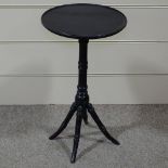 A Victorian Aesthetic ebonised wine table on ring turned base, 15" across