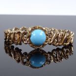 A Victorian gold plated turquoise expanding bracelet, with central cabochon turquoise panel and