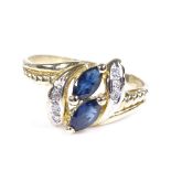 A 14ct gold sapphire and diamond dress ring, setting height 11.6mm, size N, 2.6g