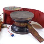 A Tibetan drum in embroidered silk case, case diameter 10cm