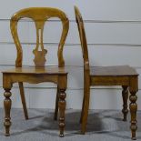 A pair of Victorian walnut hall chairs