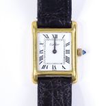 A lady's 18ct gold plated Cartier manual wristwatch, with white face and Roman numeral hour markers,