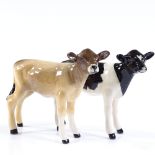 A Beswick Friesian calf, and a Beswick Guernsey calf, boxed (2)