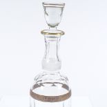 A cut-glass mallet-shaped decanter with gilded bands, height 33cm
