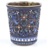 A 19th century small Russian silver and enamel drinking tot, with floral design champleve enamel