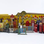 A collection of die cast signs, telephone boxes, post boxes, and 2 boxed sets of Dinky road signs