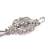 An American 14ct white gold diamond bracelet, with central heart-shaped rose-cut diamond, pierced