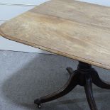 A George IV rectangular mahogany tilt-top breakfast table, on centre column and quadruple base