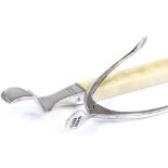 A silver and ivory-handled orange peeler, by Hukin & Heath, hallmarks London 1910, length 12cm,