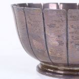 A circular silver bowl, of fluted form, by Cooper Brothers & Sons Ltd, hallmarks Sheffield 1975,