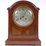 A mahogany 8-day dome-top mantel clock, circa 1920, with silvered dial, case height 34cm