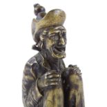 An early 20th century bronze figure of a crouching man, height 9.5cm
