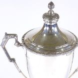 A very large silver 2-handled trophy, with acanthus leaf finial, reeded removable lid rim, geometric