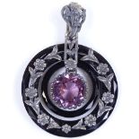 An Arts and Crafts amethyst jet and unmarked silver pendant, with textured floral settings and