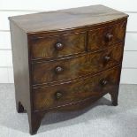 A 19th century mahogany bow-front chest of drawers of small size, with turned handles and bracket