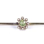 An Edwardian 15ct gold peridot and seed pearl bar brooch, length 60.9mm, 3.5g (1 pearl missing)