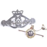 A 9ct gold militaria bar brooch, together with a Victorian silver Scottish design brooch, largest