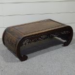 A Chinese hardwood opium table, with panelled top and dragon carved frieze, length 3'2"