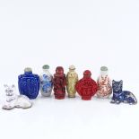 A pair of small Oriental enamelled cats, and group of Chinese snuff bottles