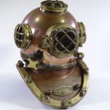 A reproduction copper and brass US Navy diving helmet