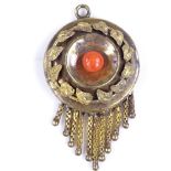 A Victorian unmarked gold and coral pendant, with textured leaf border and hanging en tremblant