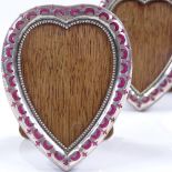 An Edwardian pair of silver and velvet-fronted heart-shaped photo frames, by Alfred George