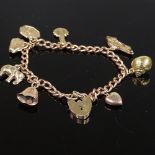 A 9ct gold heart lock curb link charm bracelet, with 8 9ct gold charms, 13.8g total