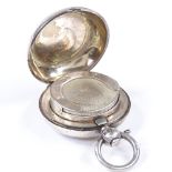 A circular silver sovereign case, with engine turned decoration, by Dennison Watch Case Co,