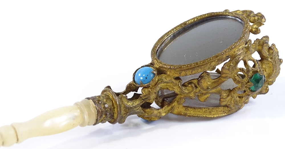 A Victorian gilt-metal posy holder, with inset mirrors and paste stones, and turned mother-of-