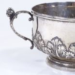 An Edwardian silver 2-handled bowl, with relief embossed acanthus leaf decoration and figural design