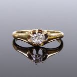 An unmarked gold solitaire diamond gypsy ring, settings test as 18ct gold, diamond approx 0.15ct,