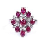 An 18ct white gold ruby and diamond cluster cocktail ring, setting height 17.6mm, size Q, 5.7g