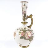 A Royal Worcester ewer, with hand painted and gilded floral designs, and reticulated handle, pattern
