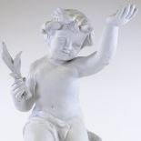 An unglazed Bisque porcelain figure of a cherub on rocks, height 60cm