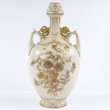 A Royal Worcester 2-handled narrow-necked vase, with hand painted and gilded floral decoration,