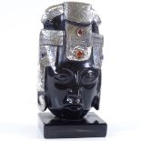 A carved obsidian Aztec head with stone set silver mounts, height 17cm