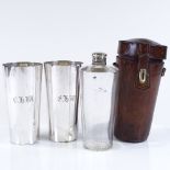 A Victorian leather-cased travelling spirit bottle, and a pair of matching electroplate beakers,