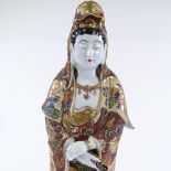 A Japanese painted and gilded porcelain standing figure, height 43cm