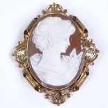 A relief carved cameo brooch, depicting female Classical portrait, in pierced and engraved 9ct